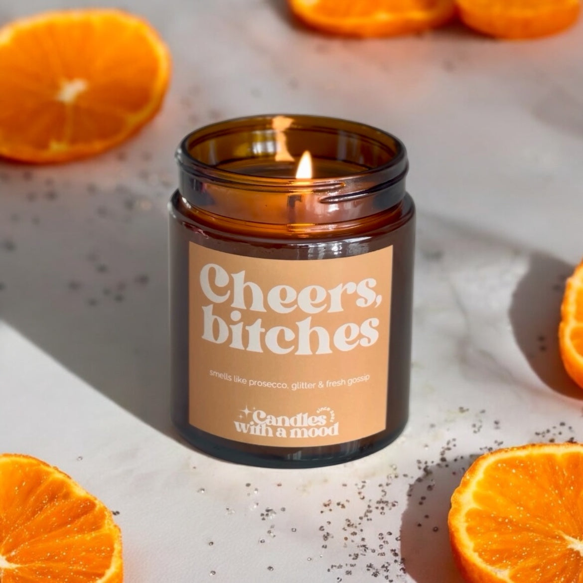 Lumânare parfumată din ceară de soia CHEERS BITCHES amber -sweet orange -patchouli 250g